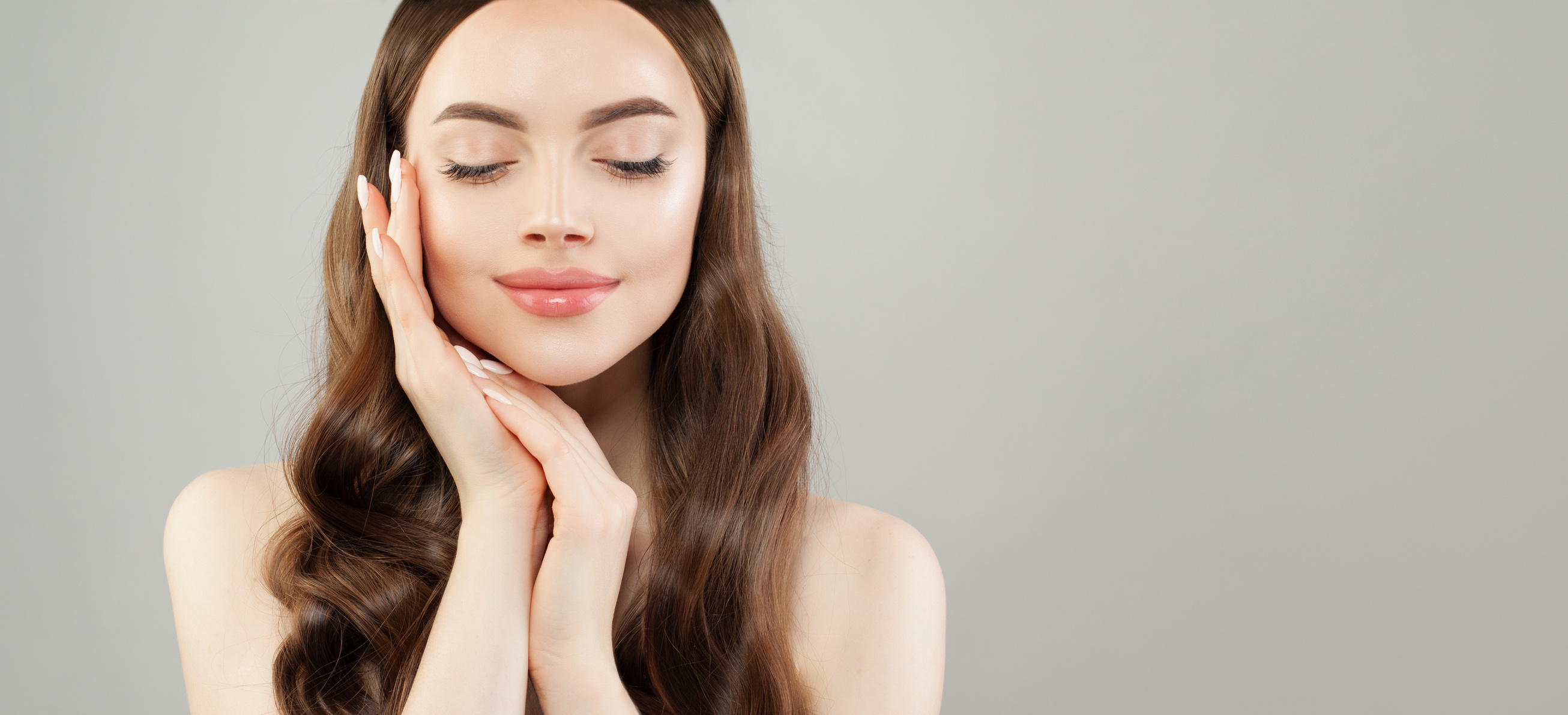 Cheerful model woman with clear skin relaxing